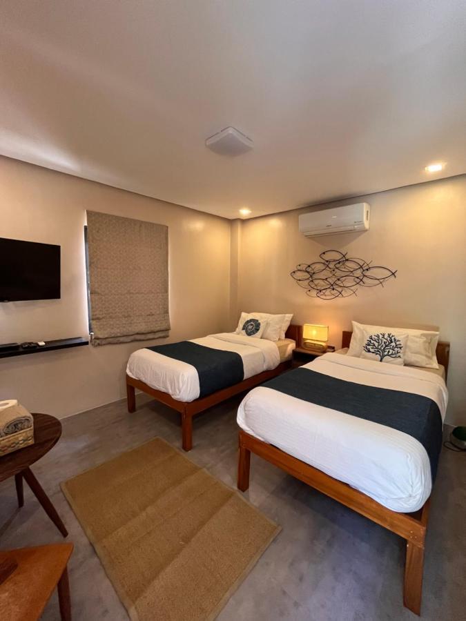 Southseas Beach Resort And Dive Center Santander Exteriör bild