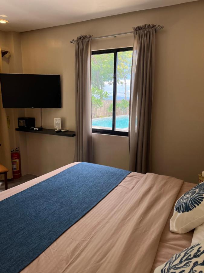 Southseas Beach Resort And Dive Center Santander Exteriör bild