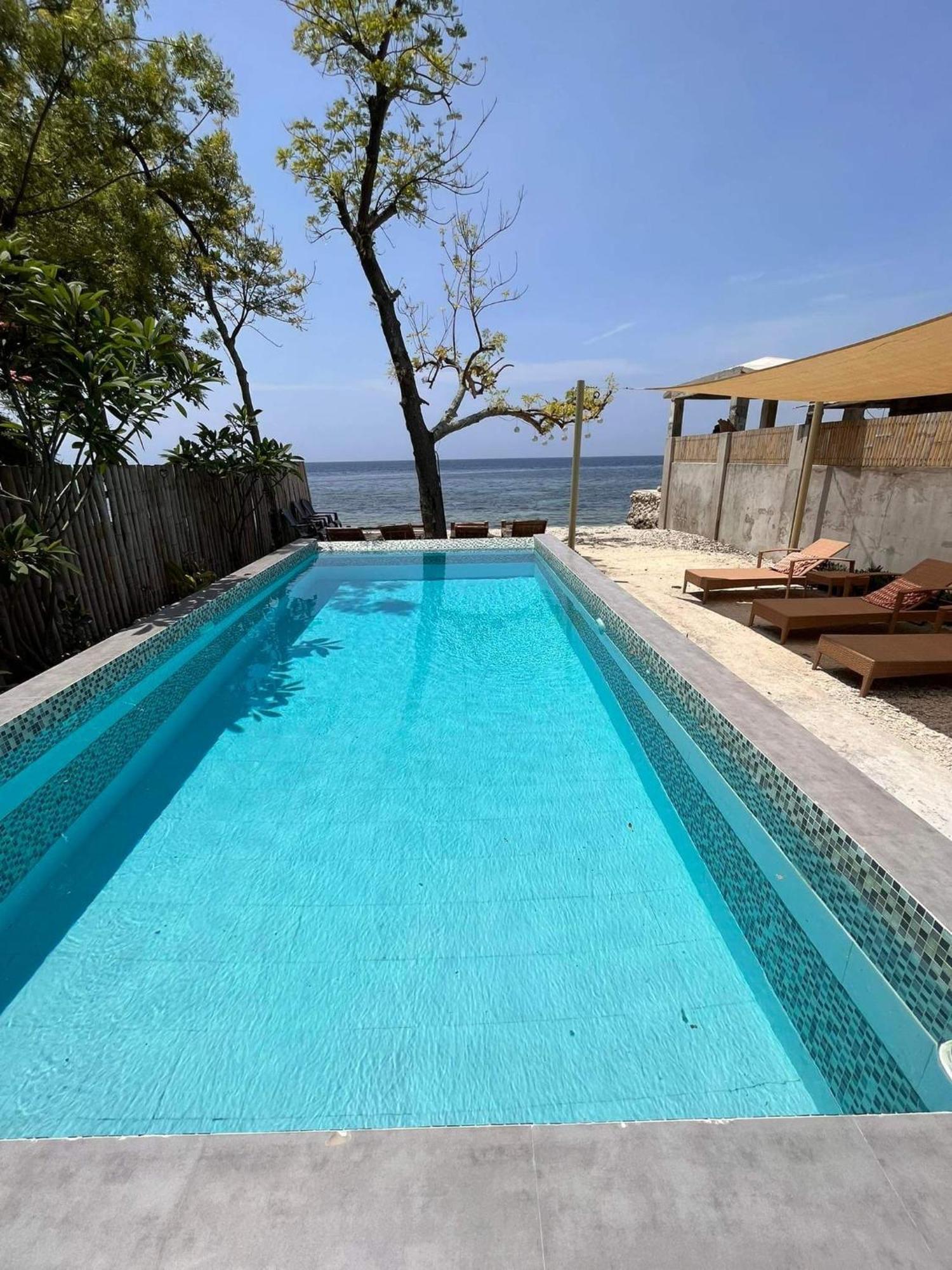 Southseas Beach Resort And Dive Center Santander Exteriör bild